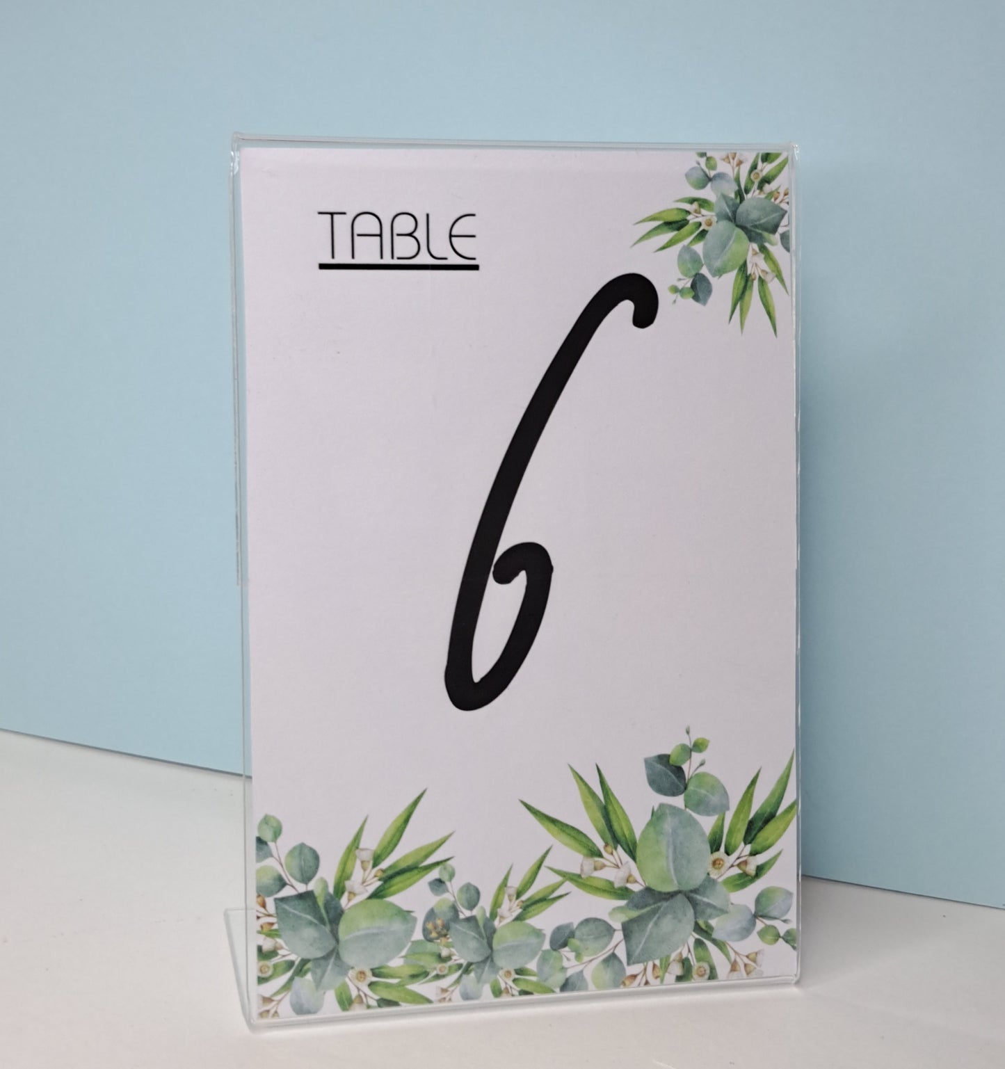 Table numbers in clear stand