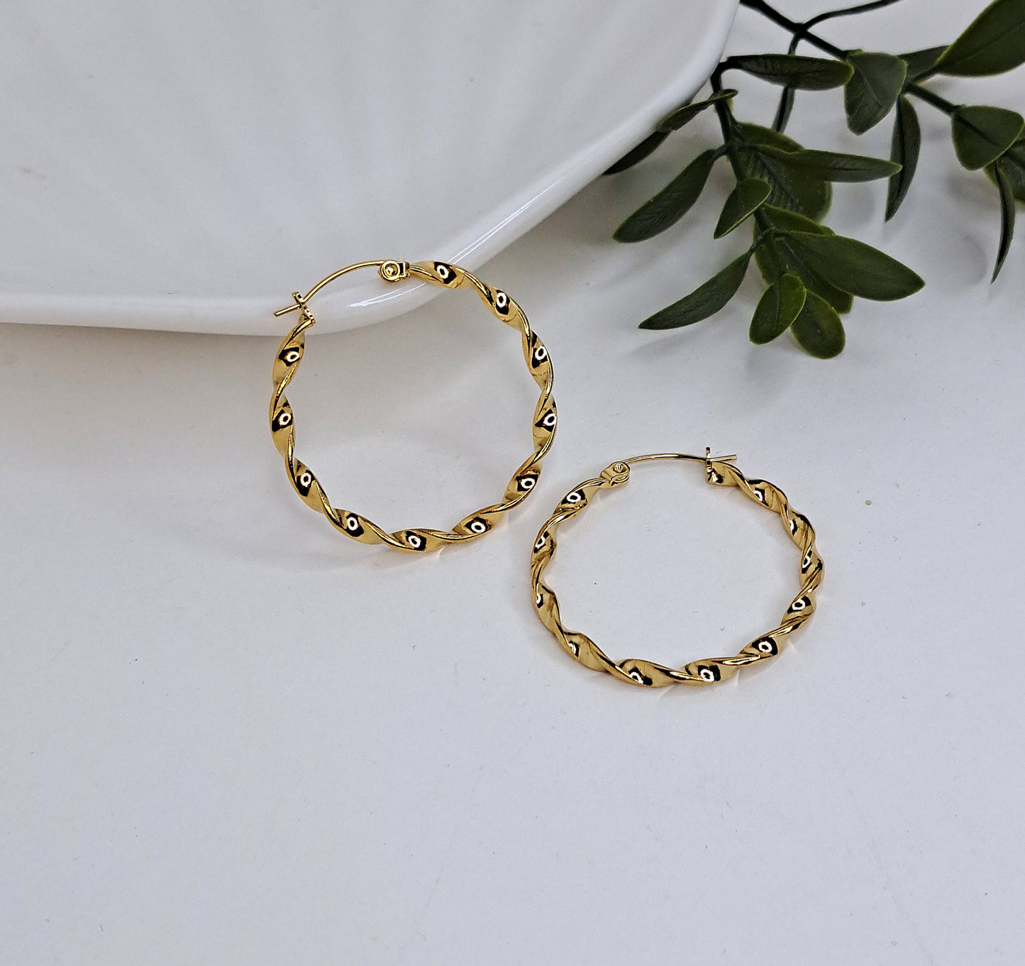 Twisted gold hoop earrings